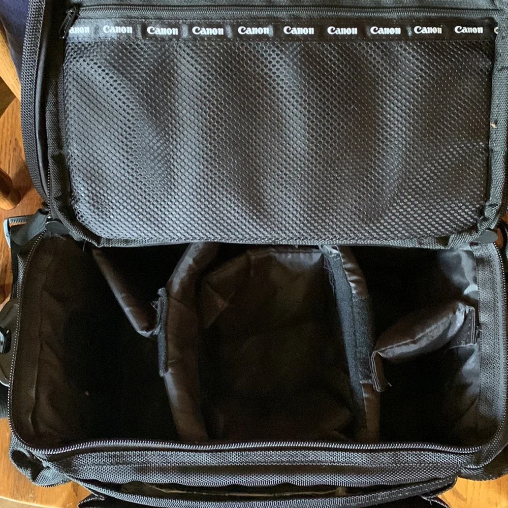 Canon camera bag with many pockets, zippers, straps, 5 inside compartments. EUC
